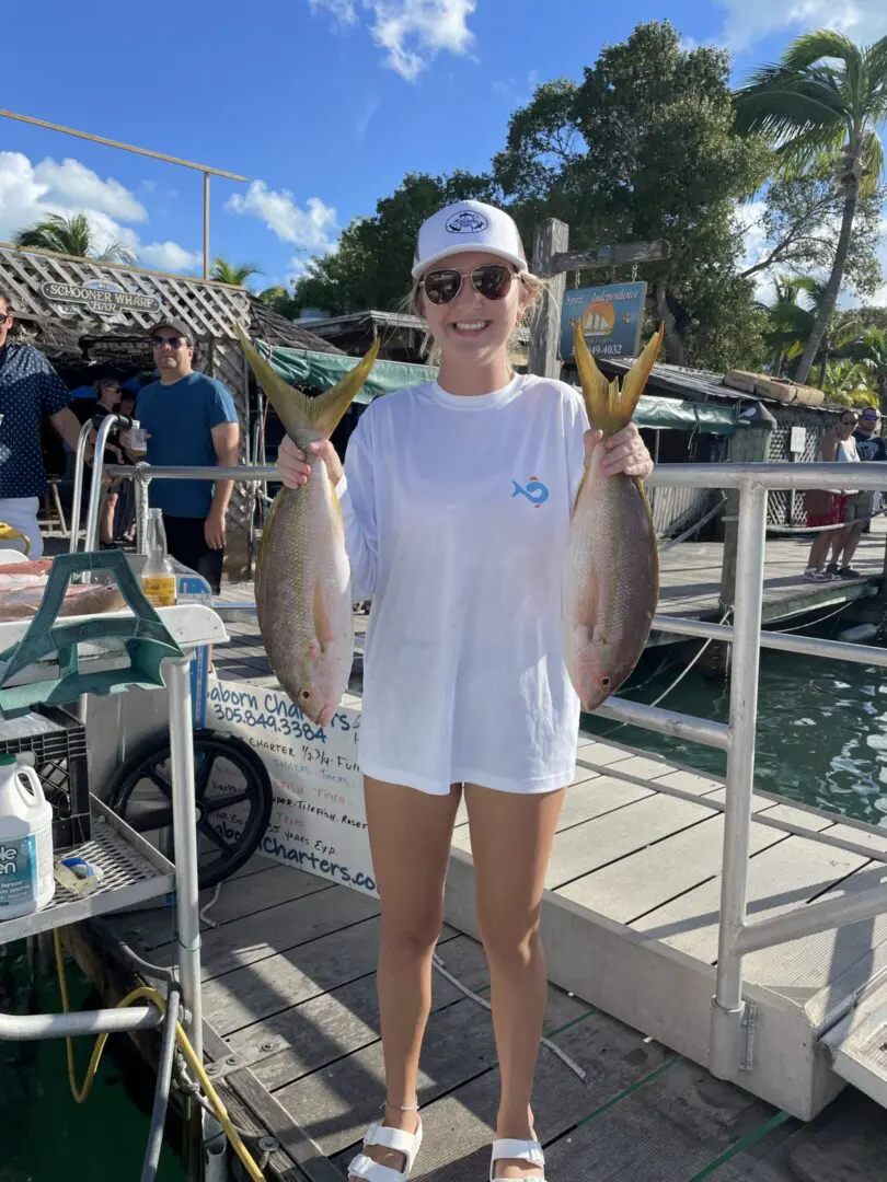 Woman in white shirt with fish