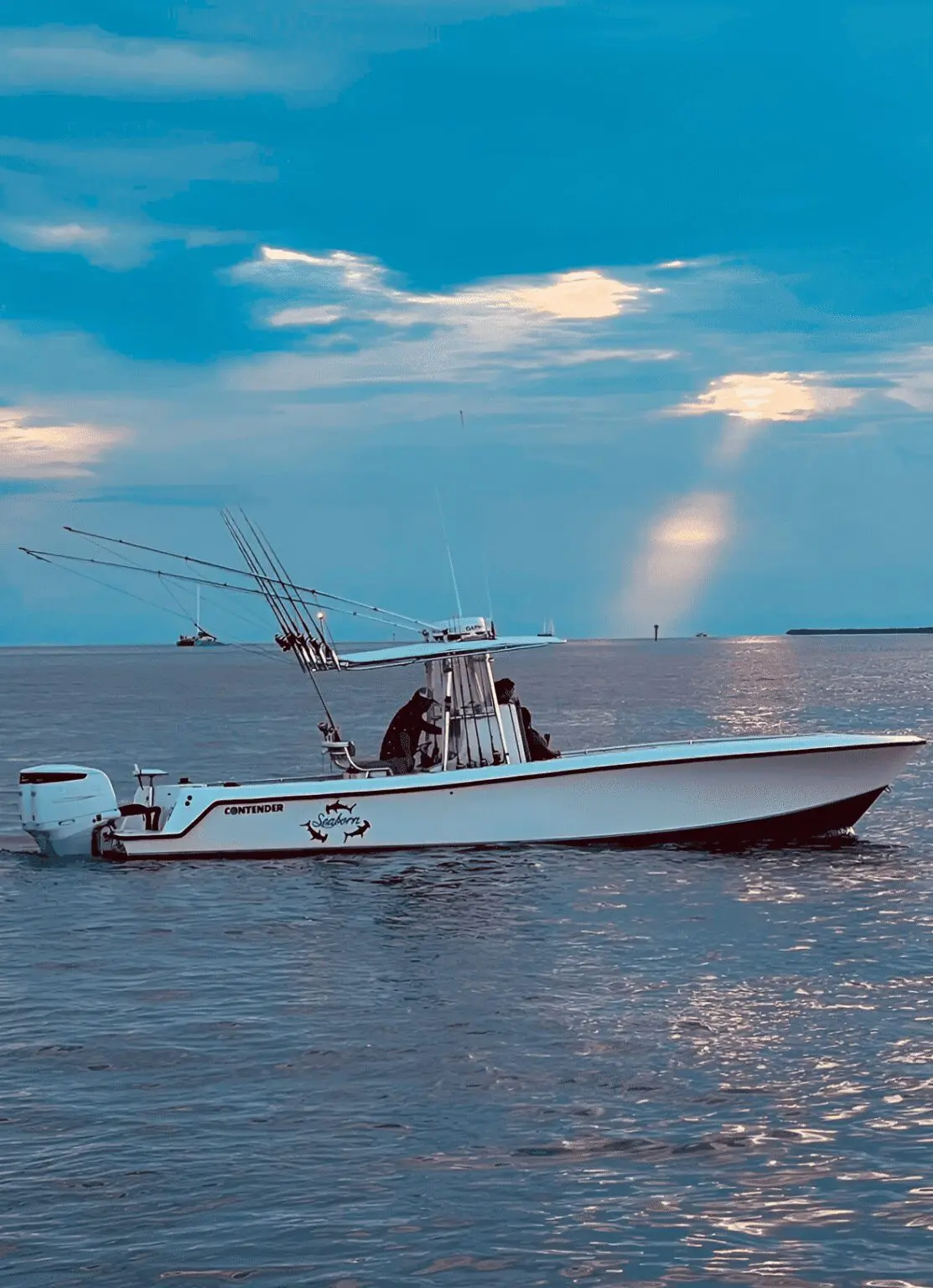 Fishing boat on calm waters at dusk